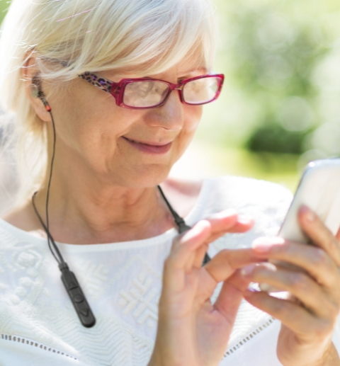 woman using cell phone with ACCESS